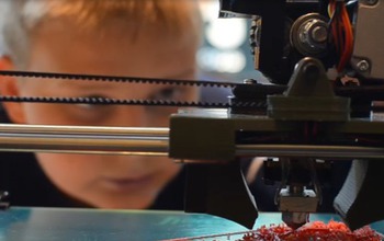 Child looking at a machine